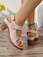 Women's open toe block heel sandals with faux leather straps and mid-heel height, perfect for casual or dressy occasions.