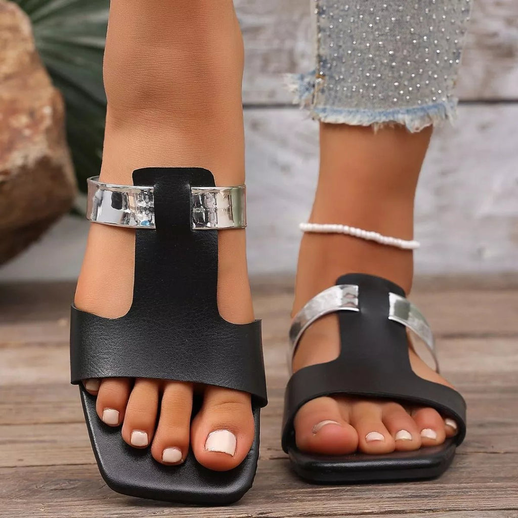 Women's open-toe vegan leather flat sandals with minimalist design, comfortable for everyday wear, by Trendsi.