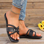 Women's open-toe vegan leather flat sandals from Trendsi, featuring a chic design and comfortable everyday footwear style.