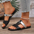 Women's open-toe vegan leather flat sandals with straps, stylish and comfortable for everyday wear.