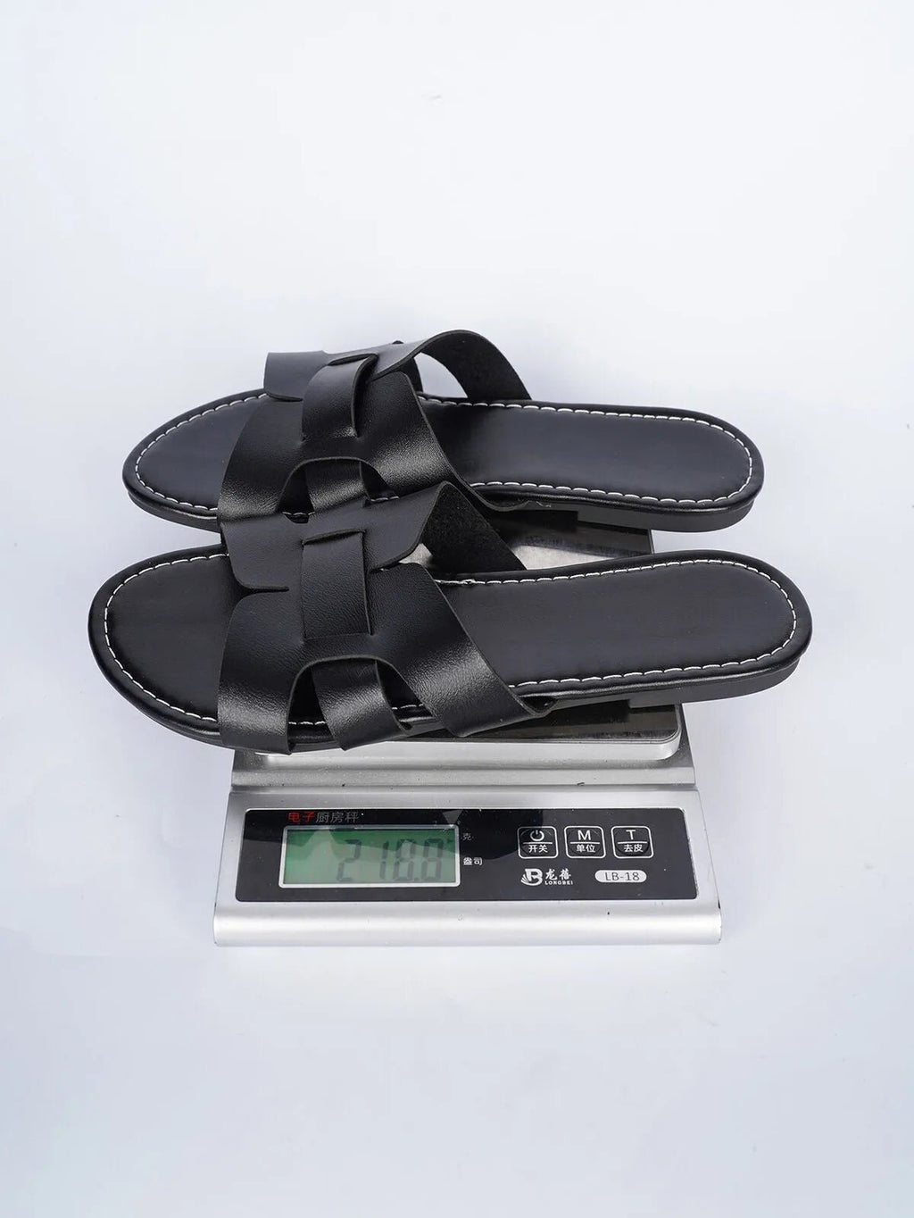Women's faux leather open-toe flat sandals with a comfortable design, featuring a stylish and breathable open-toe style.