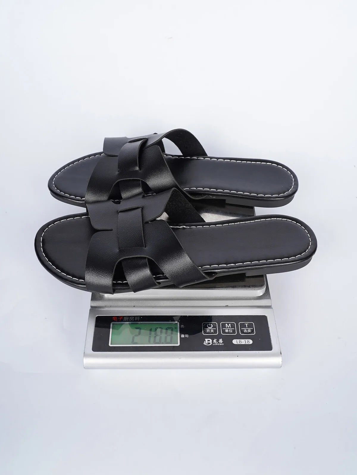 Women's faux leather open-toe flat sandals with a comfortable design, featuring a stylish and breathable open-toe style.