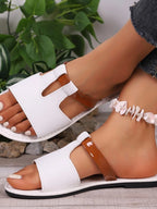 Women's chic vegan leather open toe flat sandals by Trendsi, featuring a stylish design perfect for comfortable summer wear.