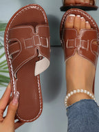 Women's open-toe flat sandals by Trendsi featuring a chic, casual design ideal for summer footwear.