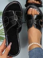 Women's open-toe flat sandals by Trendsi with a casual design, featuring comfortable straps and a stylish summer footwear look.
