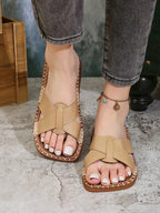 Women's open-toe PU leather flat sandals with comfort sole, perfect for summer casual wear, featuring stylish design from Trendsi.