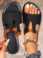 Women’s chic vegan leather open toe flat sandals by Trendsi, featuring a stylish design and comfortable fit for summer wear.
