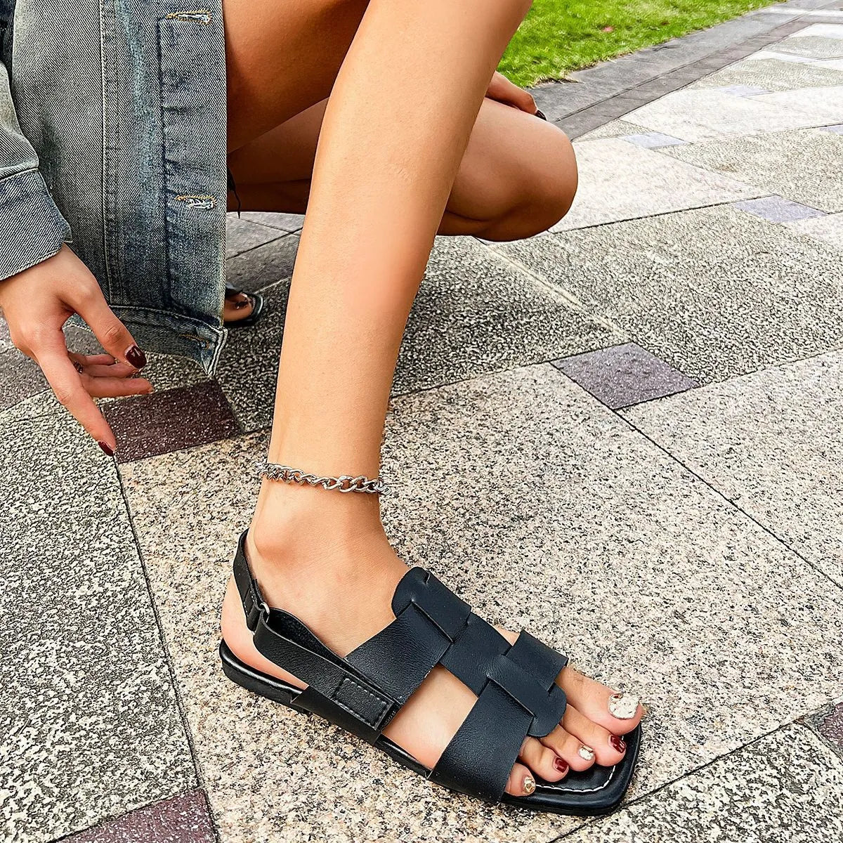 Women's vegan leather open toe flat sandals by Trendsi, featuring comfortable summer footwear with stylish design and open-toe style.