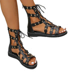 Women's lace-up open toe flat sandals by Trendsi, stylish summer footwear with comfortable design and open-toe style.