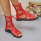 Women's open-toe lace-up flat sandals by Trendsi, featuring a stylish design and comfortable summer footwear with open toes.