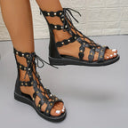 Women's lace-up open toe flat sandals by Trendsi, featuring comfortable summer footwear with stylish open-toe design and breathable material.