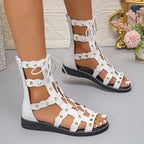 Women's lace-up open toe flat sandals by Trendsi, stylish summer footwear with comfortable design and breathable open-toe style.