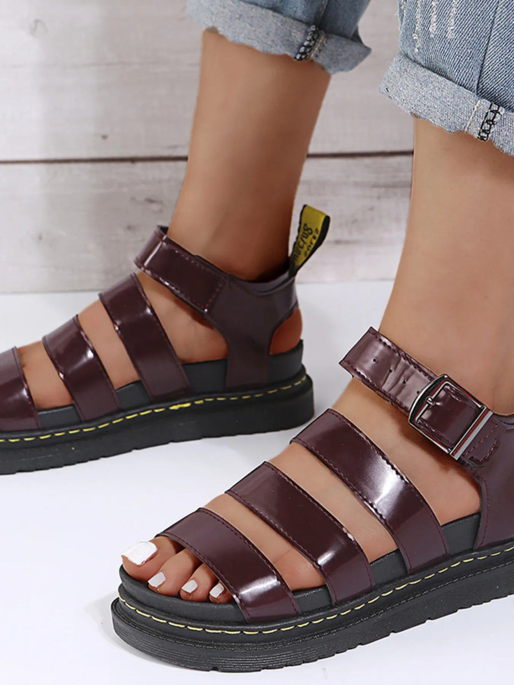 Women's open toe platform sandals in chic faux leather with a trendy slide design, perfect for stylish warm-weather wear.