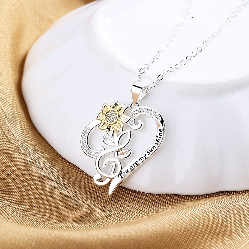 Pastoral-style two-color sunflower pendant on heart-shaped clavicle chain, jewelry piece by Plush Fashion Hub.