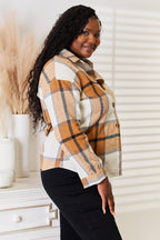 Women's casual plaid long sleeve shirt with dropped shoulders from Trendsi, featuring a relaxed fit and classic print.