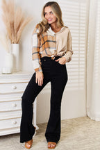 Women's casual plaid long sleeve dropped shoulder shirt by Trendsi, featuring a relaxed fit and classic plaid print.