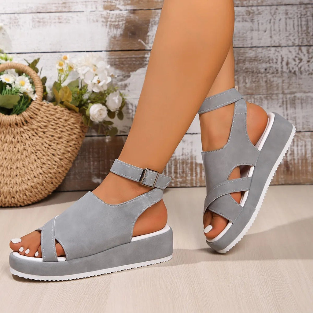 Women's platform ankle strap comfort sandals by Trendsi, featuring faux leather straps and casual slip-on style.