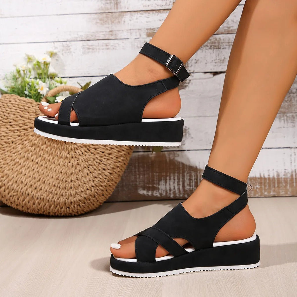 Women's platform ankle strap comfort sandals made of faux leather with casual style and supportive sole by Trendsi.