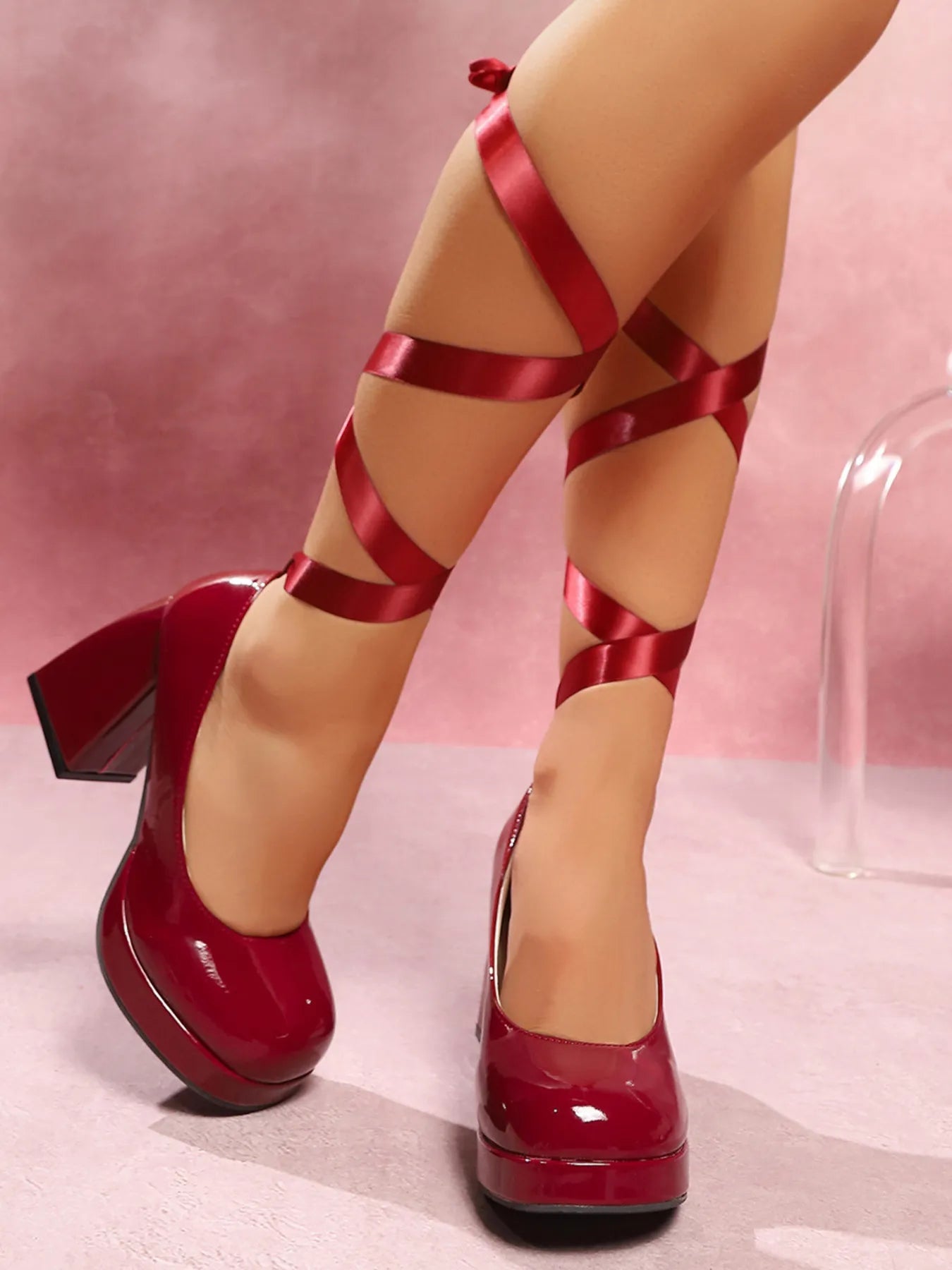 Women's platform block heel pumps by Trendsi with adjustable ankle wrap straps, featuring a stylish and comfortable shoe design.