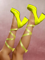 Women's platform block heel pumps with adjustable ankle wrap straps, stylish shoe by Trendsi featuring a bold heel and sleek design.