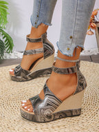 Women's faux leather platform wedge sandals with ankle strap from Trendsi, featuring a stylish and comfortable shoe design.