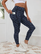 Printed high-waist fitness leggings for women with pockets, made by FitiqueFit, featuring a colorful, stylish design.