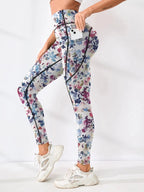 Women’s printed high-waist pocket fitness leggings by FitiqueFit, made of stretchy material with a colorful pattern and functional pockets.