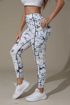Women’s printed high-waist pocket leggings by FitiqueFit, featuring a stylish pattern and comfortable fit for active wear.
