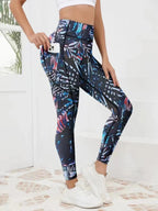 Women wearing FitiqueFit printed high-waist pocket fitness leggings with colorful abstract pattern for activewear.