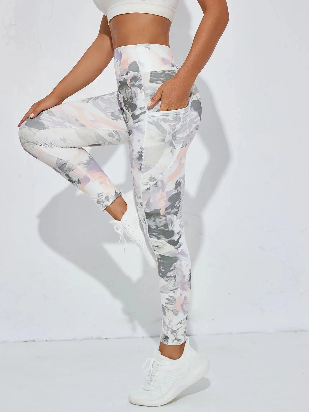 Women’s printed high-waist pocket fitness leggings by FitiqueFit, featuring a stylish pattern and comfortable stretch fit.