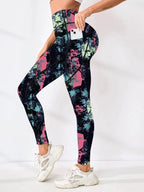 Women’s printed high-waist pocket fitness leggings by FitiqueFit, featuring a stylish design and comfortable fit for active wear.