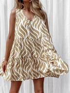 Women's printed V-neck sleeveless A-line summer mini dress from Trendsi, featuring vibrant floral pattern and lightweight fabric.