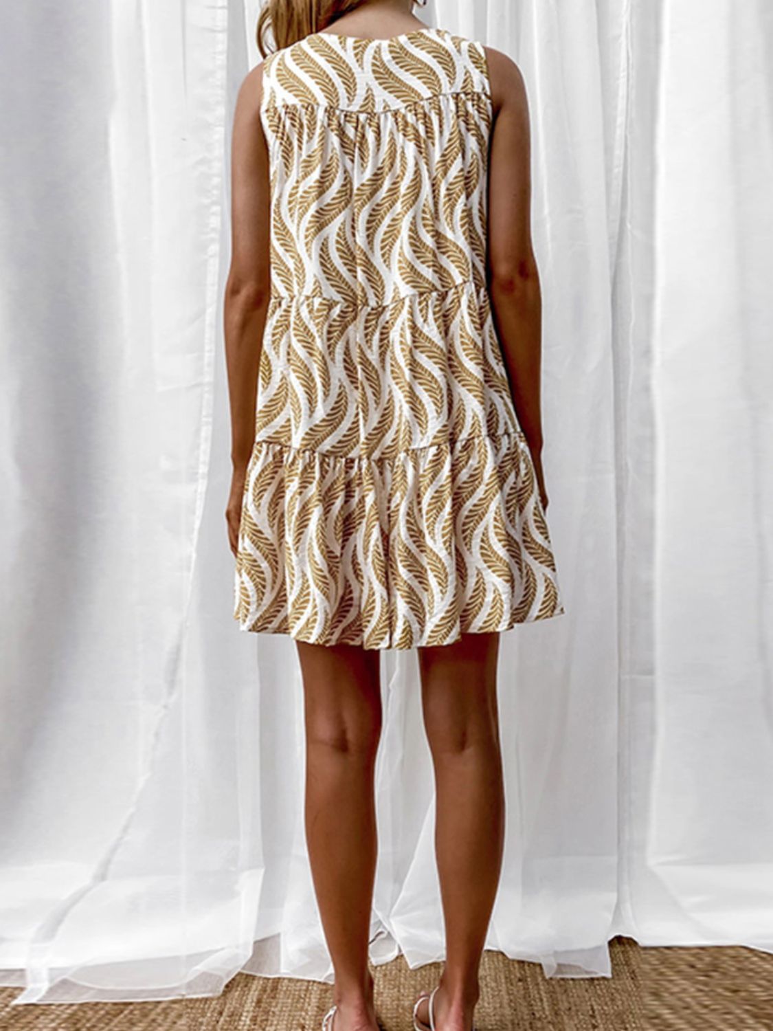 Women’s printed V-neck sleeveless A-line mini dress, perfect for summer, featuring vibrant floral patterns and a stylish V-neck design.