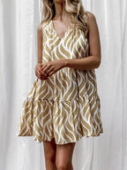 Women's printed V-neck sleeveless A-line summer mini dress from Trendsi, featuring vibrant floral pattern and comfortable fit.