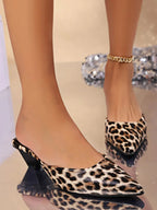 Women's faux leather pointed toe low heel sandals with stylish design, perfect for dressy occasions.
