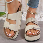Women's studded black PU leather platform sandals with edgy design and comfortable footbed, trendy footwear by Trendsi.