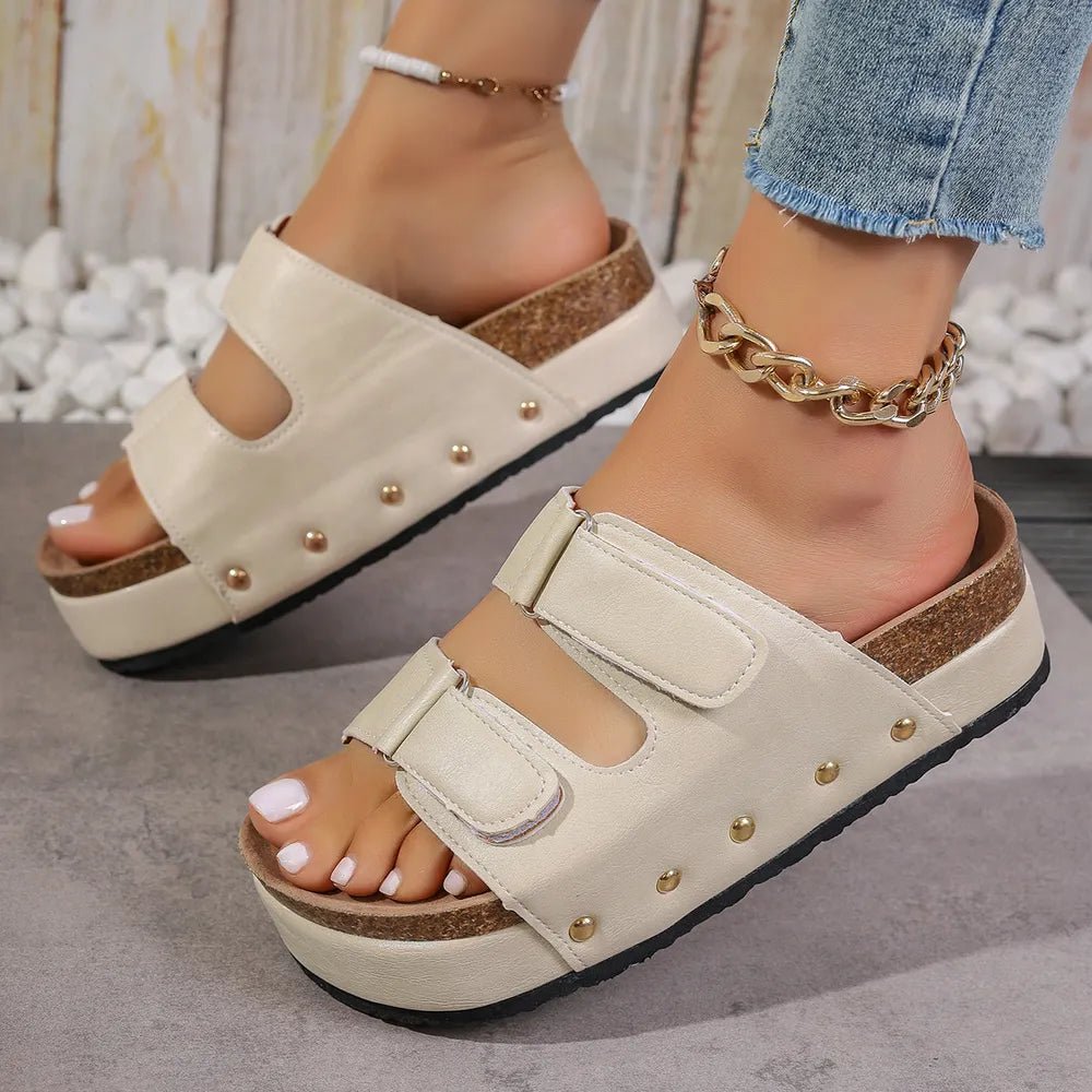 Women's studded PU leather platform sandals featuring edgy design and comfortable fit, perfect for stylish summer footwear.