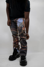 Purple ARMOR JEANS RM202SK graphic printed stacked jeans with bold design and tapered fit, shown on a model in the image.