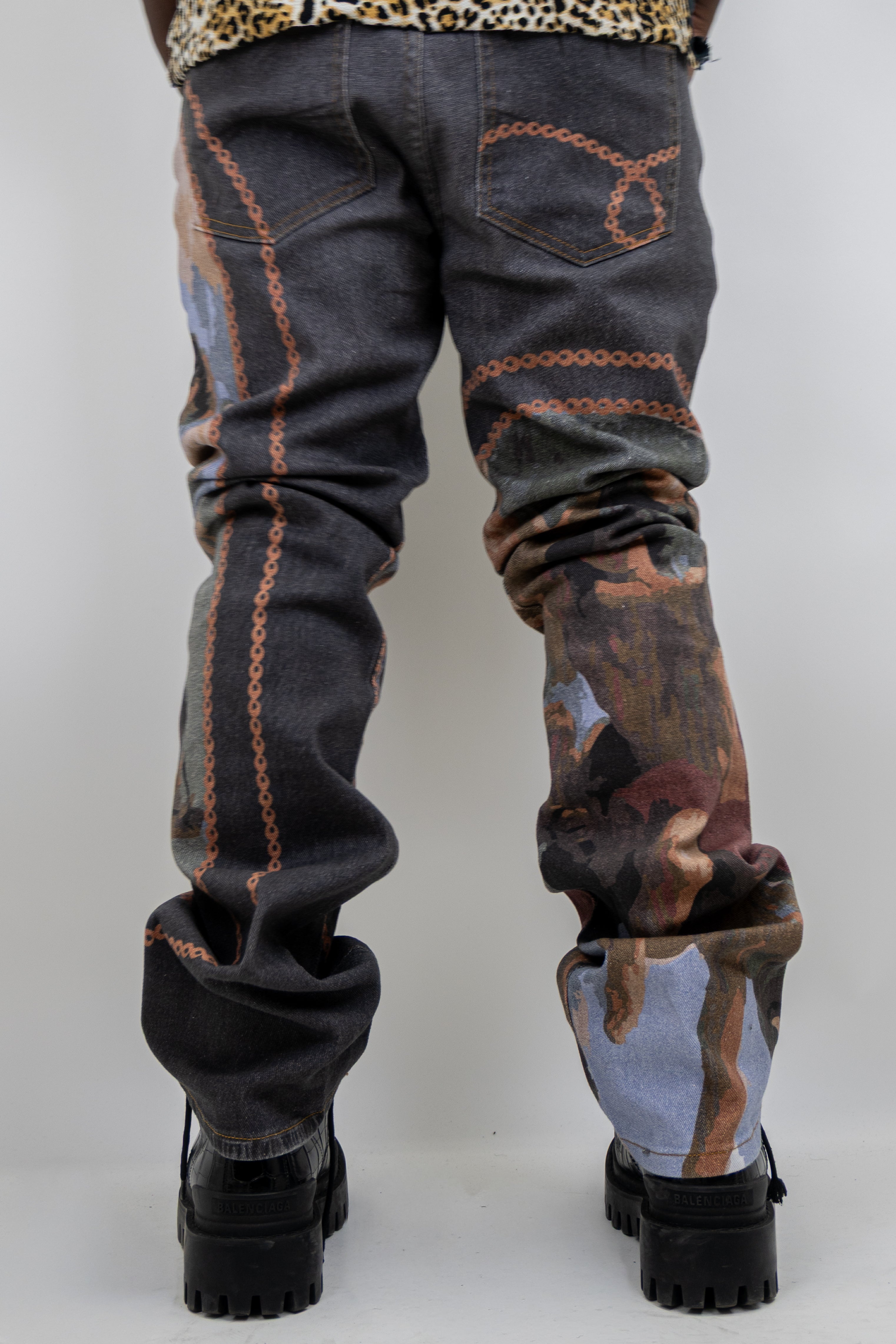 Purple stacked jeans with graphic print from ARMOR JEANS, featuring a stylish design and layered denim look.