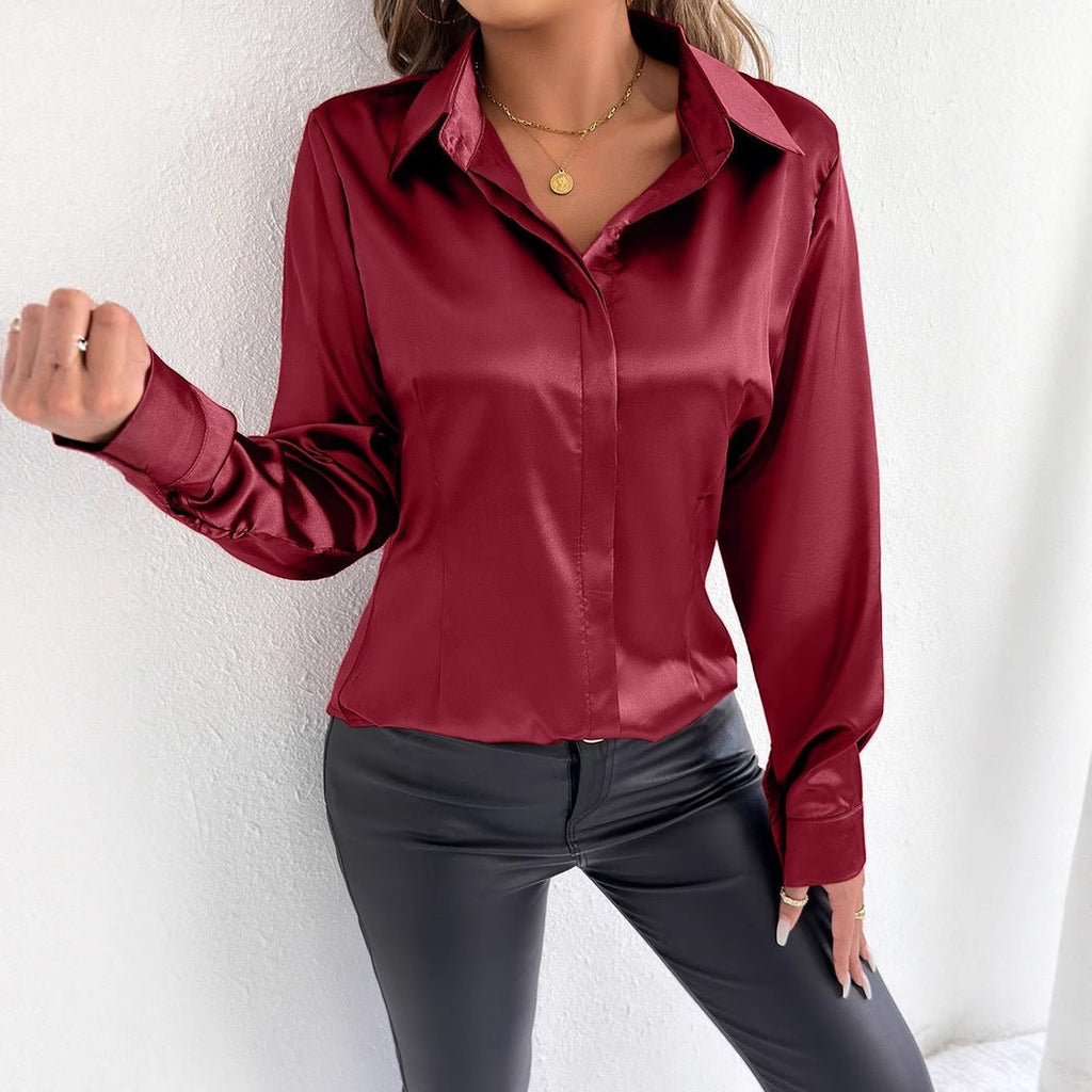 Real shot of Bella Mia women's satin summer shirt made from artificial silk, featuring a smooth, shiny fabric and classic collar design.