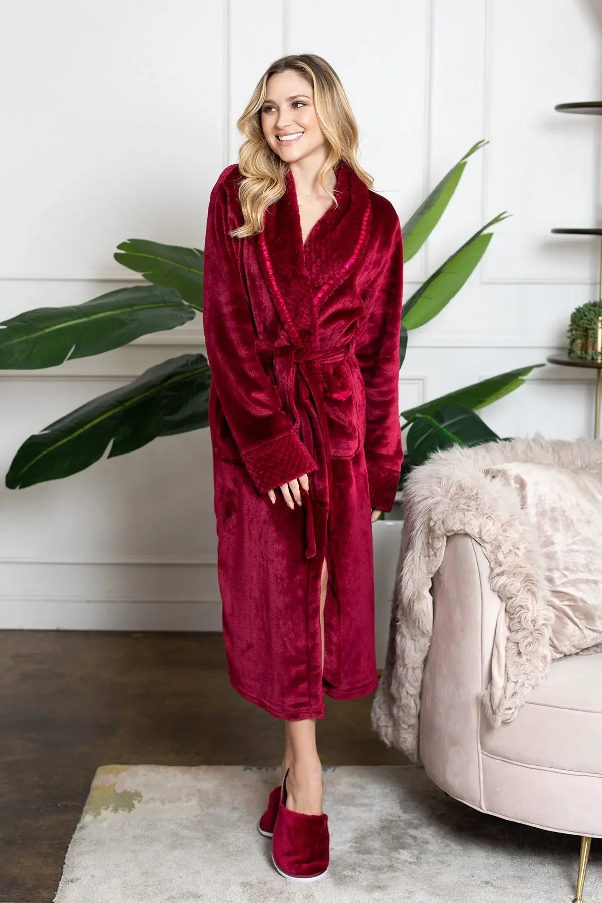 Red plush women's bathrobe from Plush Fashion Hub, showcasing its soft, cozy fabric and relaxed fit.