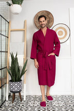 Red men's waffle spa bathrobe by Plush Fashion Hub, lightweight and absorbent, shown hanging on a hook.