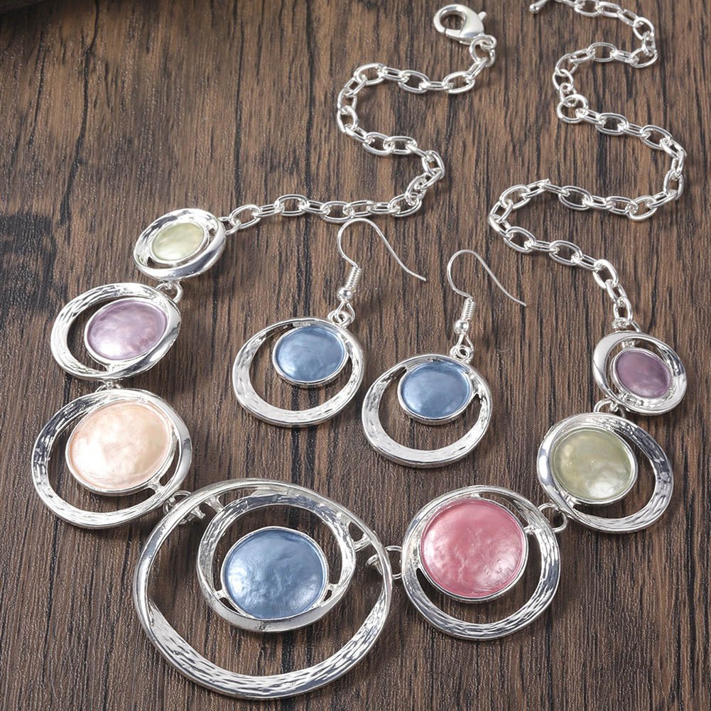 Gold-tone retro oil-dropped hollow round earrings and matching women's necklace set, stylish jewelry by Plush Fashion Hub.