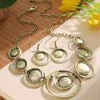 Retro oil-dropped hollow round earrings and matching women's necklace from Plush Fashion Hub, featuring stylish jewelry with a vintage look.