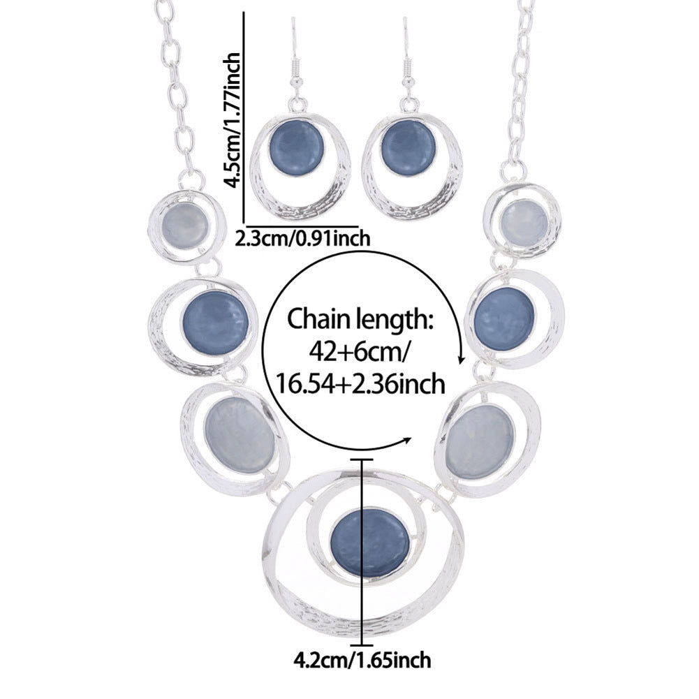 Stylish retro oil-dropped hollow round earrings and matching women's necklace with a vintage-inspired design.
