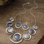 Retro oil-dropped hollow round earrings and matching necklace set for women, featuring stylish gold-tone jewelry from Plush Fashion Hub.