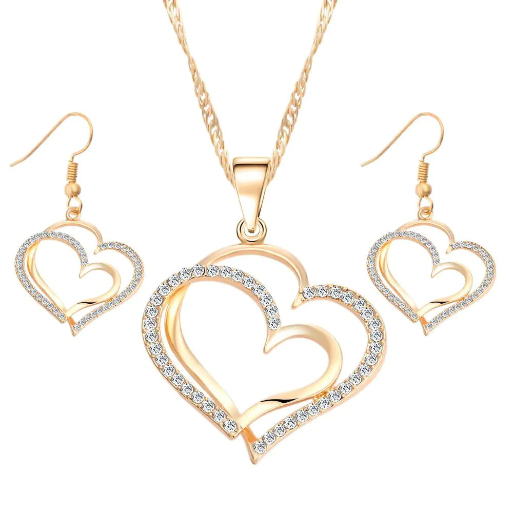 Double heart wedding jewelry set featuring a necklace and earrings with romantic heart design, by Plush Fashion Hub.