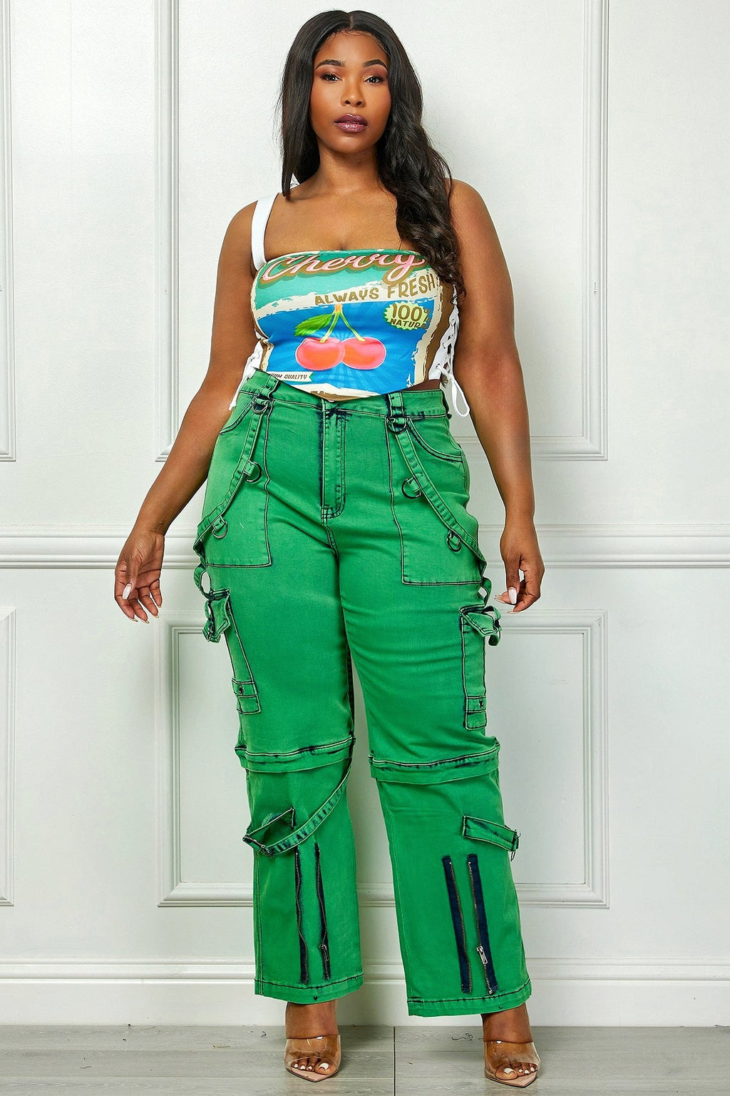 Plus size green denim cargo pants by Fasheabe, featuring multiple pockets and a relaxed fit, styled as casual bottoms.