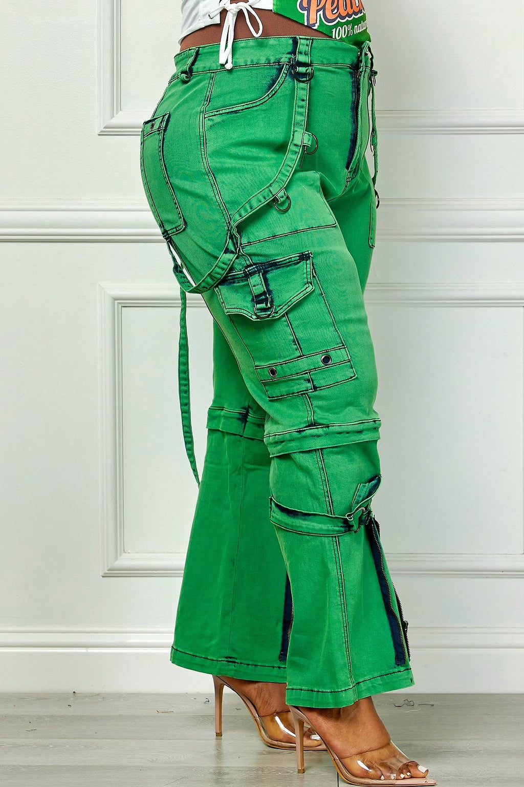 Plus size green denim cargo pants from Oh So Crafty Utility collection by Fasheabe, featuring multiple pockets and a relaxed fit.