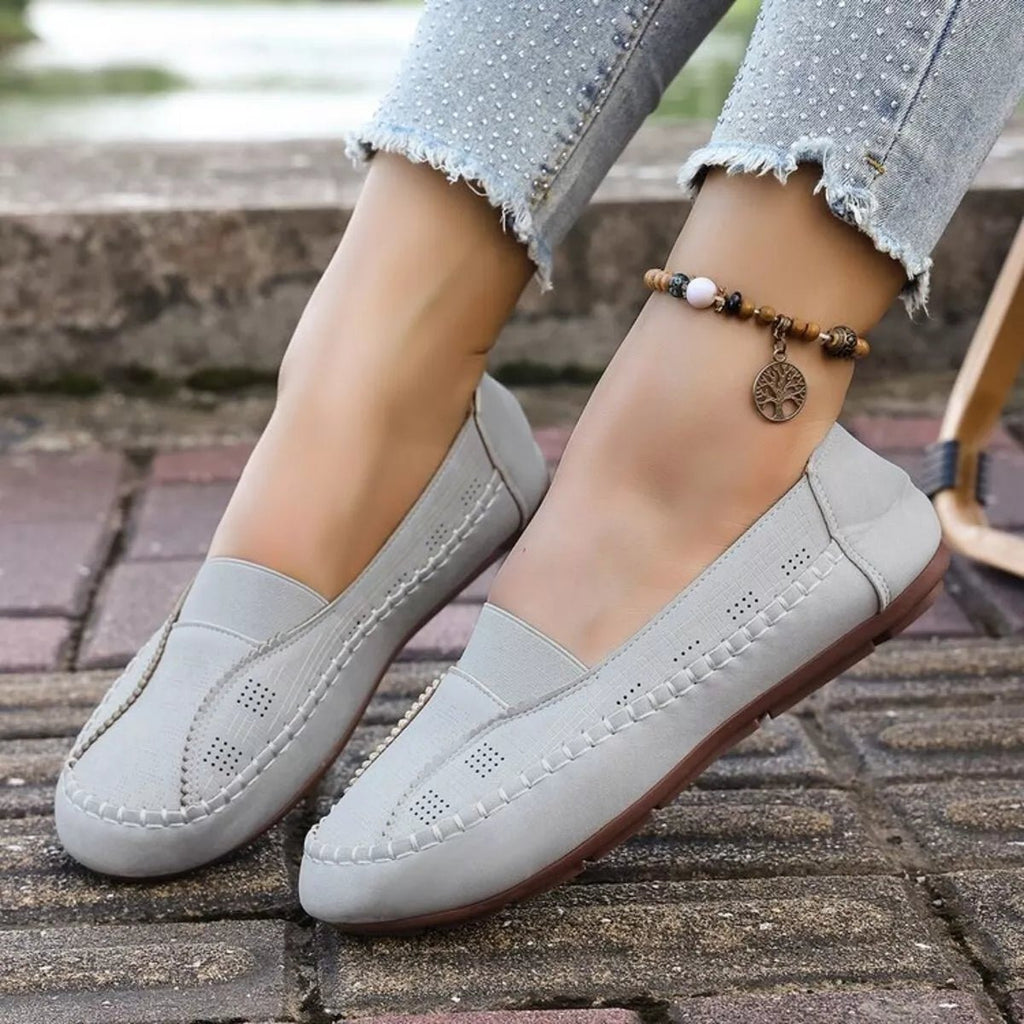 Women's breathable mesh slip-on flats with round toes, comfortable walking shoes by Trendsi featuring a sleek, casual design.
